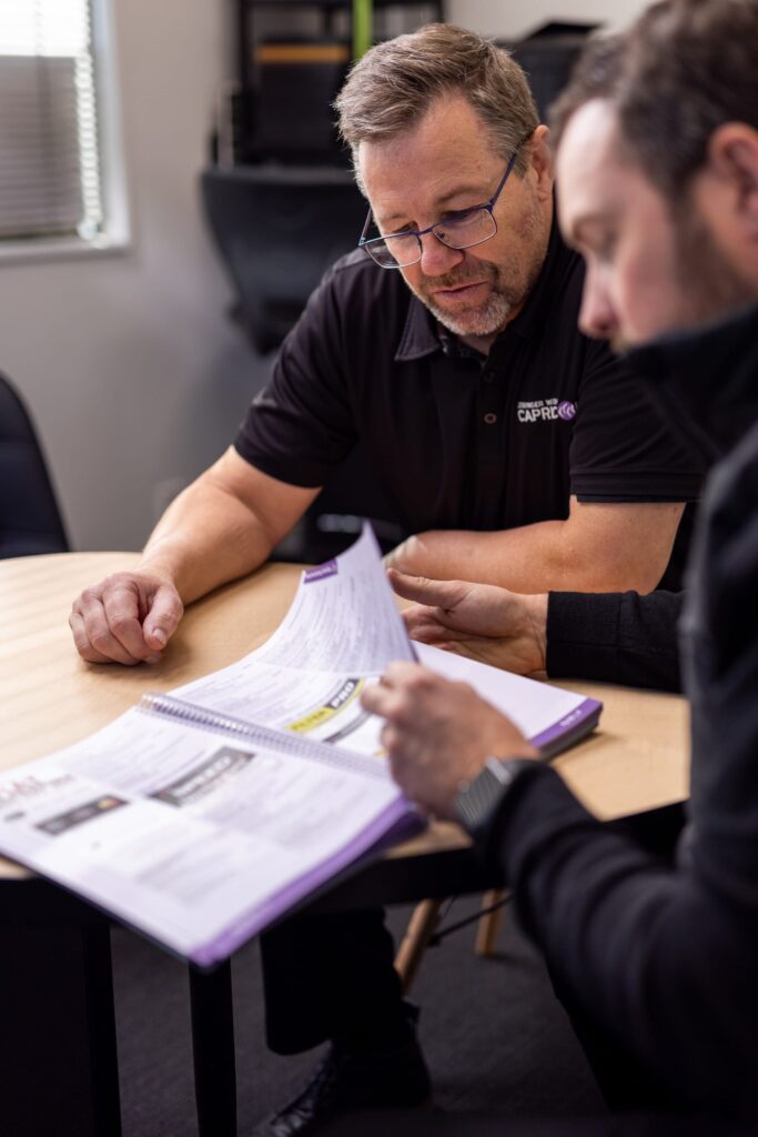 image of Straight-N-Paint employee talking to collision repair customer at Rangiora office in Canterbury