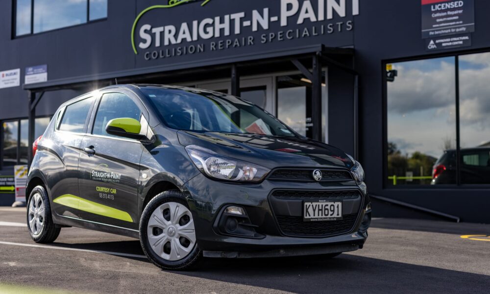 image of Straight-N-Paint branded company car parked outside of automotive repair workshop near Christchurch, Canterbury