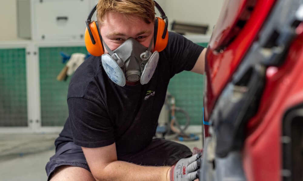 image of Straight-N-Paint mechanic wearing PPE whilst providing panel beating in Rangiora