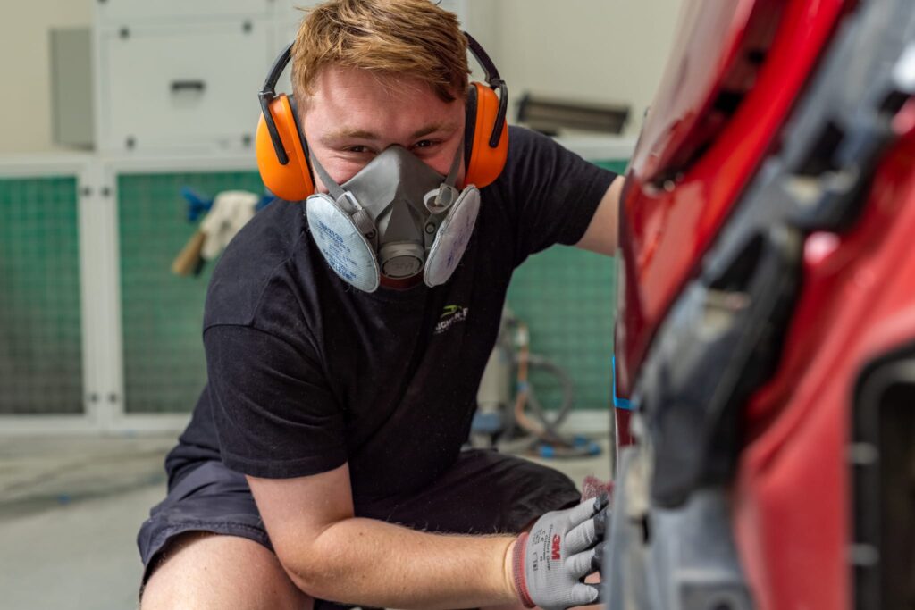 image of Straight-N-Paint mechanic wearing PPE whilst providing panel beating in Rangiora